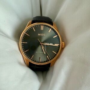 Mido Black and Gold Timepiece